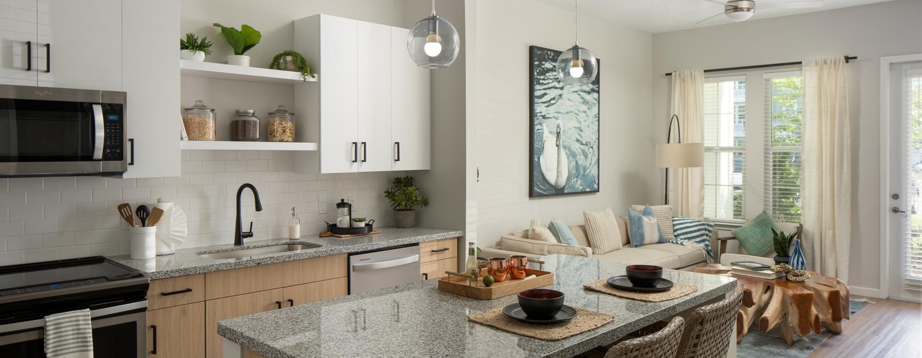 a kitchen with a dining table and a large island