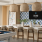 a clubroom kitchen with a large island and chairs