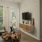 a living room with a bed and a table