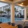 an outdoor patio with a pool seating and ping ping table