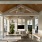 covered patio with a tv and seating
