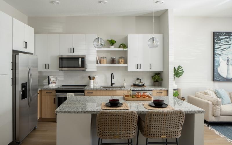 a kitchen with a table and chairs